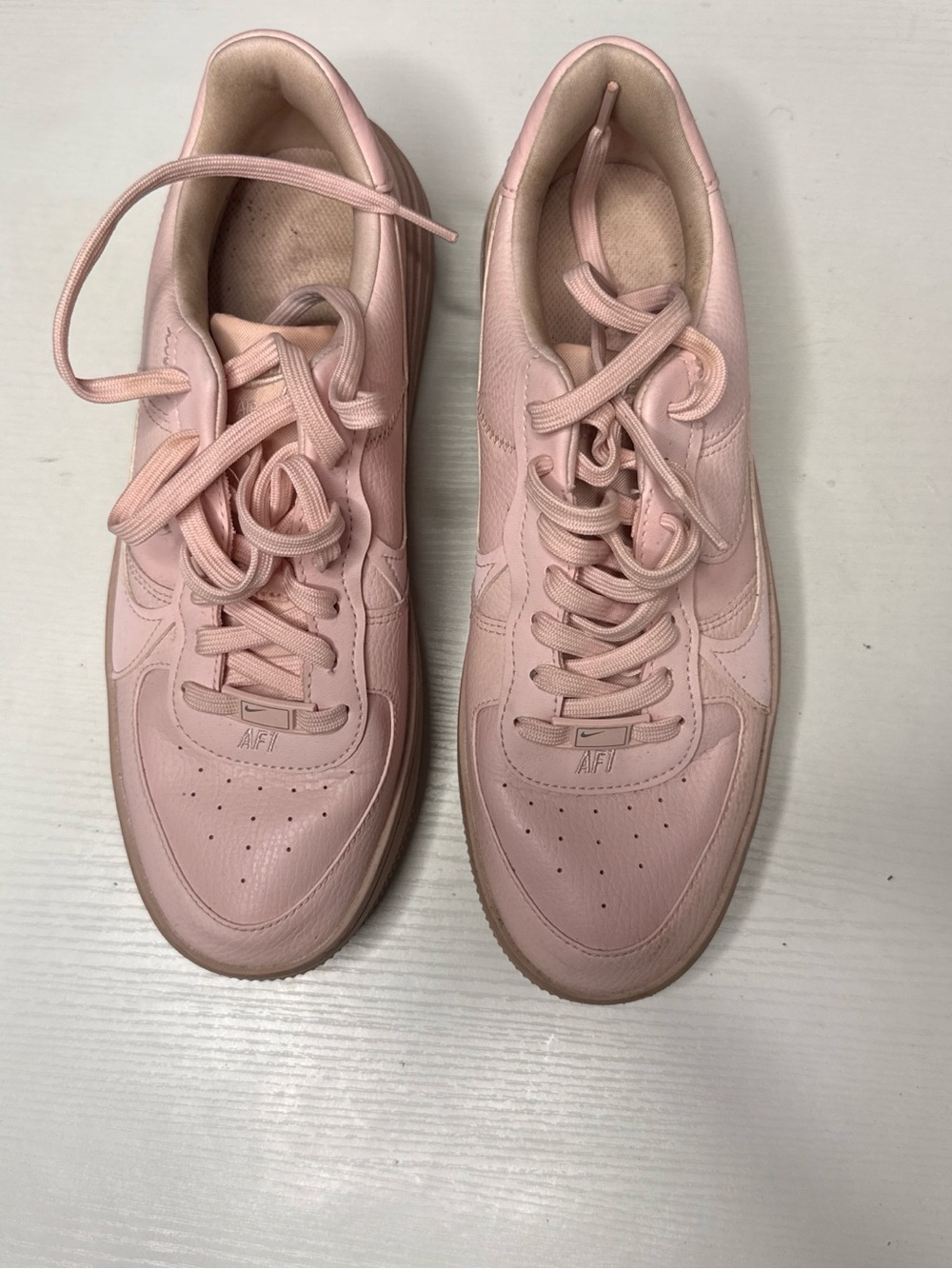 Nike Women’s Pale Pink Leather Low-Top Sneakers